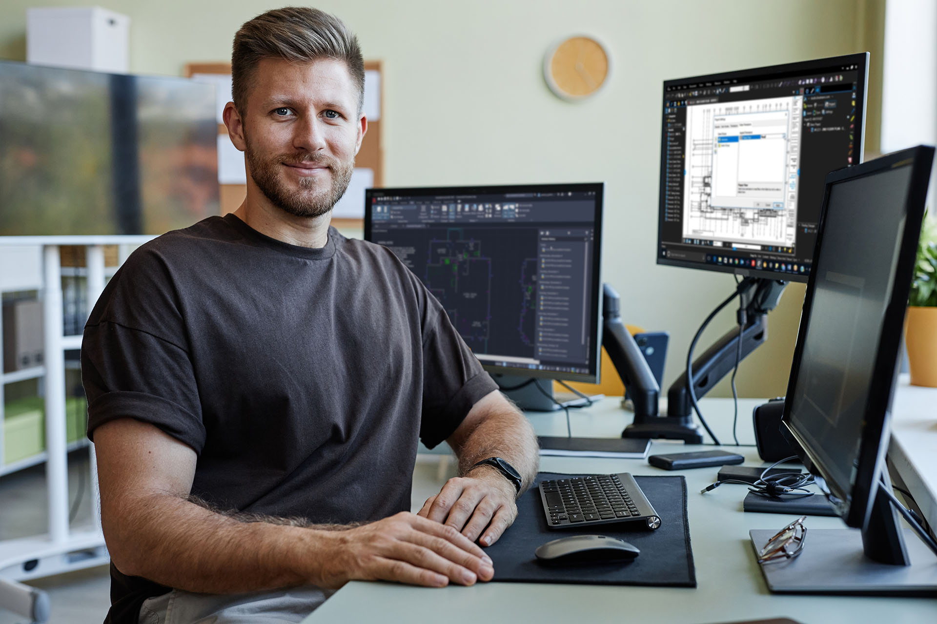 Man Smiling Desk AutoCAD Multiple Monitors